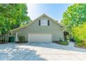 Spacious garage with ample parking, a well-maintained exterior, and a convenient side entry door at 5232 Silchester Ln, Charlotte, NC 28215