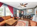Inviting living room with rich hardwood floors and a comfortable seating area, exuding classic charm at 9200 Surrey Rd, Mint Hill, NC 28227