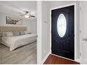 An inviting front entrance featuring a decorative door that leads into a bedroom area at 9209 Tibble Creek Way, Charlotte, NC 28227