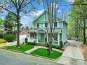 Charming two-story home with a welcoming front porch and well-maintained landscaping, showcasing curb appeal at 110 Sonnys Way, Fort Mill, SC 29708
