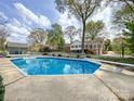 A captivating in-ground pool offers a refreshing oasis and adds to the charm of the backyard at 12011 Stoney Meadow Dr, Mint Hill, NC 28227