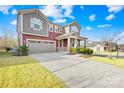Charming two-story home with attached garage and manicured lawn in a suburban neighborhood at 12706 Heath Grove Dr, Huntersville, NC 28078