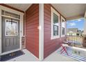Inviting front porch with seating area, perfect for relaxing and enjoying the outdoors at 12706 Heath Grove Dr, Huntersville, NC 28078