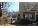 Exterior side view of home featuring a fenced yard at 13016 Meadowmere Rd, Huntersville, NC 28078