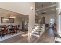Bright foyer with hardwood floors, staircase and dining room featuring elegant chandelier at 1358 37Th Avenue Ne Pl, Hickory, NC 28601