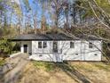Charming exterior with a painted brick facade, black trim, and a covered porch, offering curb appeal at 2120 Green Oak Dr, Shelby, NC 28152