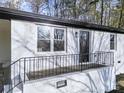 Inviting front porch with black railing and a matching front door, providing a welcoming entrance at 2120 Green Oak Dr, Shelby, NC 28152