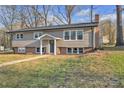 Charming home with neutral siding, brick foundation, and a well-manicured lawn at 3205 19Th Ne Ave, Hickory, NC 28601
