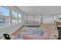 Bright living room featuring hardwood floors, large windows, and modern furniture at 3205 19Th Ne Ave, Hickory, NC 28601