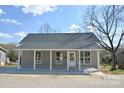 Charming single-story home with a welcoming front porch, offering curb appeal and outdoor living space at 333 City Ave, Lancaster, SC 29720