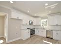 Modern kitchen with white cabinetry, stainless steel appliances, and stylish countertops at 333 City Ave, Lancaster, SC 29720