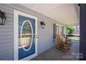 Inviting front porch with rocking chairs, perfect for relaxing and enjoying the outdoors at 4487 Catawba Burris Rd, Denver, NC 28037