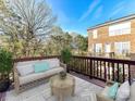 Outdoor deck with comfortable seating and views of the surrounding greenery at 7854 Springs Village Ln, Charlotte, NC 28226