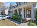 Charming covered front porch with white columns and neat landscaping at 878 Treasure Ct, Fort Mill, SC 29708