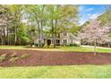 Beautiful two-story brick home with lush lawn and landscaping at 107 Bare Foot Ln, Mooresville, NC 28117
