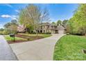 Beautifully landscaped brick home with an inviting driveway and curb appeal at 107 Bare Foot Ln, Mooresville, NC 28117