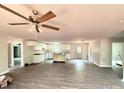 Spacious open-concept living area with modern ceiling fan, hardwood floors, and natural light at 1127 Mckay Rd, Newton, NC 28658