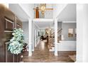 Elegant foyer with hardwood floors, a staircase, and views into the living room at 1214 Foxfield Rd, Waxhaw, NC 28173
