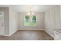 Dining room featuring chandelier, wood floors and natural light at 1320 Beaconfield Ct, Rock Hill, SC 29730