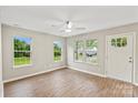 Bright living room with wood floors, white trim, and natural light at 1320 Beaconfield Ct, Rock Hill, SC 29730
