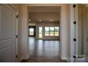 Bright and airy living room with expansive windows and sleek wood flooring, offering a modern and inviting space at 1429 Coppergate Dr, Salisbury, NC 28147