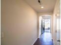Inviting foyer with hardwood floors and an arched entryway to the rest of the home at 2035 Talbert Ct, Charlotte, NC 28214