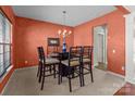 Charming dining area with a modern chandelier and stylish decor, perfect for intimate meals at 2319 Arbor Vista Dr, Charlotte, NC 28262