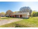 Inviting single-story brick home with a large carport and a lush, green lawn at 260 Trexler Ln, Rock Hill, SC 29732