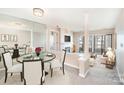 Open concept living and dining area with lots of natural light and view of lake at 329 Northwest Dr, Davidson, NC 28036