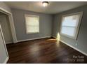 Well-lit bedroom featuring neutral walls and hardwood flooring at 3316 Queens Ln # 10, Gastonia, NC 28052