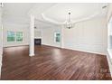 Spacious living room featuring hardwood floors, fireplace, and ample natural light at 3725 Catawba Creek Dr, Gastonia, NC 28056
