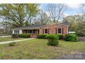 Cozy brick home with well-manicured lawn and lush landscaping at 3987 Taxahaw Rd, Lancaster, SC 29720