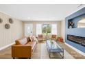 Inviting living room featuring a modern fireplace, hardwood floors, and neutral color scheme at 504 Katherine Ave, Kings Mountain, NC 28086