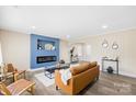 Cozy living room with an electric fireplace, hardwood floors, and stylish modern decor at 504 Katherine Ave, Kings Mountain, NC 28086