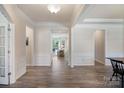 Spacious foyer with hardwood floors, white trim, and an open view into the living spaces beyond at 7116 Brookline Pl, Huntersville, NC 28078