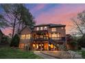 Beautiful two-story home with a spacious deck and patio, perfect for outdoor entertaining at 8915 Linden Grove Ct, Sherrills Ford, NC 28673
