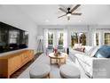 Bright living room with lots of natural light, cozy furniture and a modern, open design, perfect for relaxation at 9849 Rich Hatchet Rd, Huntersville, NC 28078