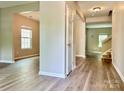 Spacious entryway with modern flooring and neutral walls leading to various rooms in the home at 12815 Towering Pine Dr, Charlotte, NC 28269