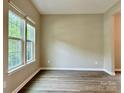 Inviting living room with large windows providing natural light and modern flooring for a comfortable space at 12815 Towering Pine Dr, Charlotte, NC 28269