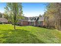 Beautiful brick home with dormer windows and a lush green lawn at 16 Shadow Dr, Taylorsville, NC 28681