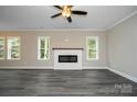 Bright and spacious living room with a modern fireplace, ample natural light, and stylish flooring at 1721 Balfour Ln, Charlotte, NC 28216