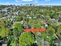 Aerial shot showcases this home's prime location near the city, nestled within a lush, tree-filled neighborhood at 2314 Wolfe St, Charlotte, NC 28205