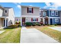 Charming townhome with neat landscaping and inviting curb appeal under blue skies at 309 River Clay Rd, Fort Mill, SC 29708