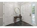Charming entryway with slate floors, console table, and white doors at 3524 Johnny Cake Ln, Charlotte, NC 28226