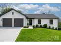 Charming, freshly painted home with a two-car garage, manicured lawn, and updated landscaping at 3730 Club House Ne Dr, Conover, NC 28613