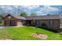 Lovely brick home featuring a well-maintained lawn and a two-car attached garage at 3730 Club House Ne Dr, Conover, NC 28613