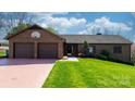 Well-kept brick home with double garage and tidy landscaping, ready for new owners at 3730 Club House Ne Dr, Conover, NC 28613