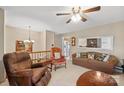 Cozy living room with plush seating, a ceiling fan and ample natural light at 409 Cardinal Dr, Newton, NC 28658