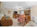 Comfortable living room features a plush sofa, armchairs, and a built-in hutch at 409 Cardinal Dr, Newton, NC 28658