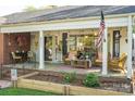 Inviting front porch with seating area, perfect for relaxing and enjoying the outdoors at 412 W D Ave, Salisbury, NC 28144